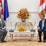 
              In this photo provided by Cambodia's Government Cabinet, Cambodian Prime Minister Hun Sen, right, and Ukrainian Foreign Minister Dmytro Kuleba, left, hold a talk during a welcome meeting at Peace Palace in Phnom Penh, Cambodia, Wednesday, Nov. 9, 2022. (Kok Ky/Cambodia's Government Cabinet via AP)
            