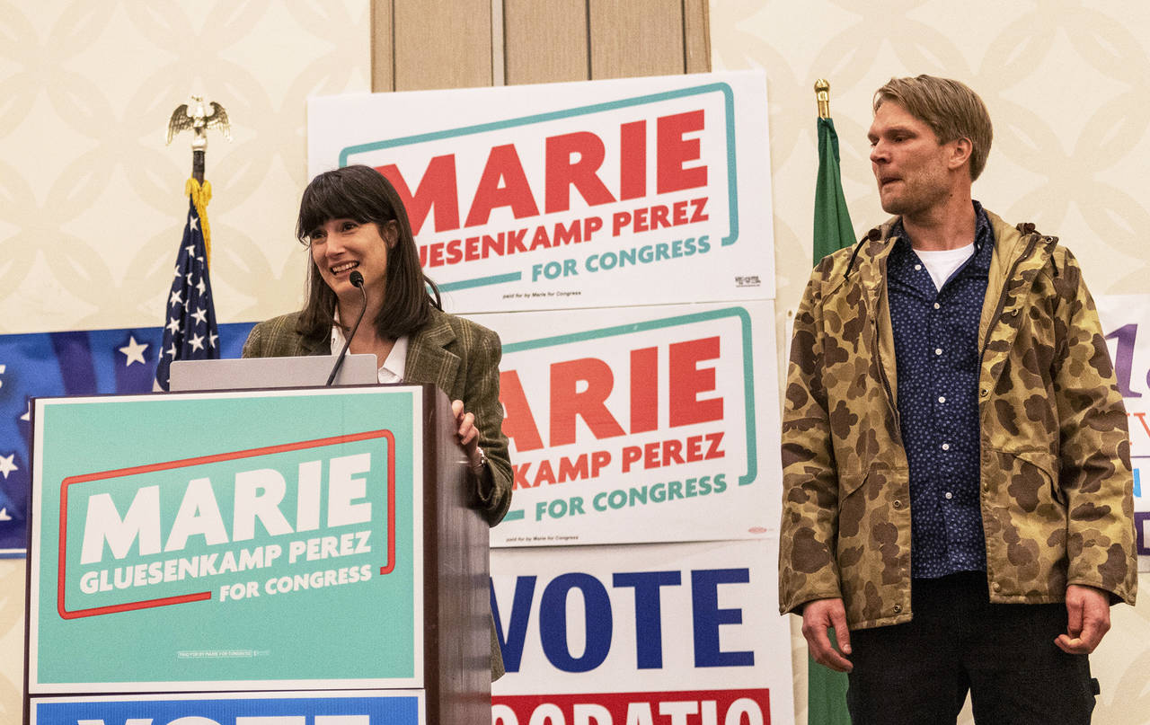 Marie Gluesenkamp Perez, left, speaks to a crowd of supporters alongside her husband Dean Gluesenka...