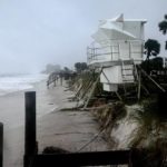 
              Tropical Storm Nicole makes landfall near Vero Beach, Fla. as a hurricane early Thursday, Nov. 10, 2022.  It's such a sprawling storm that it has covered nearly the entire peninsula while reaching into Georgia and South Carolina. (Joe Cavaretta/South Florida Sun-Sentinel via AP)
            