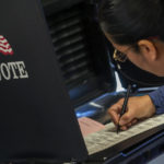 
              A woman marks her ballot at a polling center in the South Valley area of Albuquerque, N.M., Tuesday, Nov. 8, 2022 (AP Photo/Andres Leighton)
            