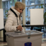 
              A voter casts her ballot at a polling station in Ljubljana, Slovenia, Sunday, Nov. 13, 2022. Slovenian voters choose between center-right former foreign minister Anze Logar and liberal candidate Natasa Pirc Musar in the runoff of the presidential election. (AP Photo/Darko Bandic)
            