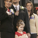 
              FILE - Then-Alaska Gov. Sarah Palin, left, her husband Todd, and daughters Bristol, 16, right, and Piper, 5, front stand as the colors are retired at the end of an inauguration ceremony in Fairbanks, Alaska, on Dec. 4, 2006. Republican Palin re-emerged in Alaska politics over a decade after resigning as governor with hopes of winning the state's U.S. House seat. But she struggled to catch fire with voters and ran what critics saw as a lackluster campaign against a breakout Democrat who pitched herself as a regular Alaskan and a Republican backed by state GOP leaders. (AP Photo/Al Grillo, File)
            