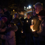 
              Robert McRuer, and Santy Rodelo, right, both of Washington, embrace during a candlelight vigil held in Dupont Circle, Monday, Nov. 21, 2022, in Washington, in memory of the victims of a gunman who opened fire with a semiautomatic rifle inside a gay nightclub in Colorado Springs, killing five people and leaving 25 injured before he was subdued by "heroic" patrons and arrested by police. "I teach LGBTQ studies at George Washington University," says McRuer, "and there are more LGBTQ students each year, it's important that we save those lives." (AP Photo/Jacquelyn Martin)
            