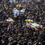 
              Syrian Kurds attend a funeral of people killed in Turkish airstrikes in the village of Al Malikiyah , northern Syria, Monday, Nov. 21, 2022. The airstrikes, which Turkey said were aimed at Kurdish militants whom Ankara blamed for a deadly Nov. 13 bombing in Istanbul, also struck several Syrian army positions in three different provinces along the border with Turkey. (AP Photo/Baderkhan Ahmad)
            