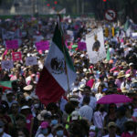 
              Citizen organizations march in support of Mexico's National Elections Institute as President Andrés Manuel López Obrador pushes to reform it, in Mexico City, Sunday, Nov. 13, 2022. (AP Photo/Marco Ugarte)
            