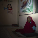 
              FILE - Munju, 82, sits in a cyclone center in Khulna, Bangladesh, during Tropical Storm Sitrang on Oct. 24, 2022. Her family members carried her to the center as she is unable to move by herself. Loss and damage is the human side of a contentious issue that will likely dominate climate negotiations in Egypt. (AP Photo/Fatima Tuj Johora, File)
            