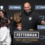 
              Pennsylvania Lt. Gov. John Fetterman, Democratic candidate for U.S. Senate from Pennsylvania, right, is joined by his family after addressing supporters at an election night party in Pittsburgh, Wednesday, Nov. 9, 2022. (AP Photo/Gene J. Puskar)
            