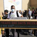 
              A climate clock displays how much time is left before the world uses up the carbon emissions that can still be produced while staying at or below the 1.5 degrees warming goal at a demonstration during the COP27 U.N. Climate Summit, Wednesday, Nov. 16, 2022, in Sharm el-Sheikh, Egypt. (AP Photo/Peter Dejong)
            