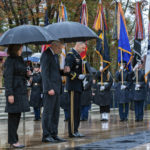 
              Vice President Kamala Harris with Veterans Affairs Secretary Denis McDonough bow their heads as the Taps is played during the National Veterans Day observance at Arlington National Cemetery, in Arlington, Va., Friday, Nov. 11, 2022. (AP Photo/Manuel Balce Ceneta)
            