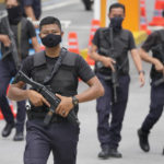 
              Armed National palace police stand guard at the National Palace in Kuala Lumpur, Malaysia, Wednesday, Nov. 23, 2022. Malaysia's king has failed to reach a decision on whom to pick as prime minister after meeting the leaders of two rival blocs, and summoned lawmakers from a political bloc that has held out its support. (AP Photo/Vincent Thian)
            