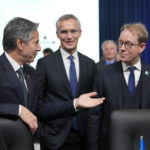 
              United States Secretary of State Antony Blinken, left, talks with NATO Secretary-General Jens Stoltenberg, center, and Sweden's Foreign Minister Tobias Billstrom during the first day of the meeting of NATO Ministers of Foreign Affairs, in Bucharest, Romania, Tuesday, Nov. 29, 2022. (AP Photo/Andreea Alexandru)
            