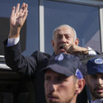 
              Benjamin Netanyahu, former Israeli Prime Minister and the head of Likud party, waves to his supporters during a national election, in Ashkelon, Israel, Tuesday, Nov. 1, 2022. (AP Photo/Tsafrir Abayov)
            