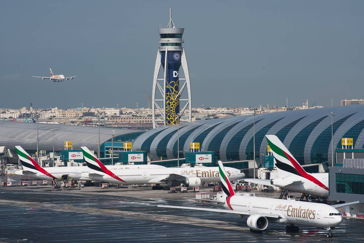 FILE - An Emirates jetliner comes in for landing at the Dubai International Airport in Dubai, Unite...