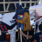 
              Migrants disembark from the German humanitarian ship Rise Above docked in the southern Italian port town of Reggio Calabria, Tuesday, Nov. 8, 2022.German humanitarian group Mission Lifeline said its ship docked in southern Italy early Tuesday and disembarked the 89 people it had rescued in the central Mediterranean. (AP Photo/Valeria Ferraro)
            