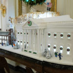 
              A gingerbread replica of the White House and a sugar cookie replica of Independence Hall are on display in the State Dining Room of the White House during a press preview of holiday decorations at the White House, Monday, Nov. 28, 2022, in Washington. (AP Photo/Patrick Semansky)
            