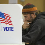 
              Troy Bloom fills out his ballot at the Cold Springs polling station in Missoula, Mont., Tuesday, Nov. 8, 2022. (AP Photo/Tommy Martino)
            