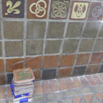 
              FILE - Tiles with swastikas have been removed from the Indiana University School of Public Health building in Bloomington, Ind., on Monday, July 8, 2019. The tiles were installed more than a century ago have been removed from the walls inside the Indiana University building. The Bloomington school says the tiles at the Indiana University School of Public Health classroom building were installed before the swastika was adopted as the symbol of the Nazi Party. They're among tiles that include symbols from different cultures. (Michael Reschke/The Herald-Times via AP)
            