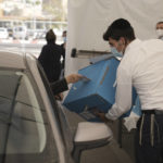 
              A COVID positive man votes during Israeli elections in Jerusalem, Tuesday, Nov. 1, 2022. (AP Photo/Mahmoud Illean)
            