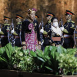 
              Indonesian President Joko Widodo and his wife Iriana review the honor guard at the Welcoming Dinner during G20 Leaders' Summit at the Garuda Wisnu Kencana Cultural Park, in Badung, Bali, Indonesia, on Tuesday, Nov. 15, 2022. (Willy Kurniawan/Pool Photo via AP)
            