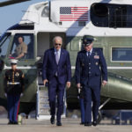 
              President Joe Biden is escorted by Col. William "Chris" McDonald, Vice Commander, 89th Airlift Wing, as he walks to board Air Force One, Thursday, Nov. 3, 2022, at Andrews Air Force Base, Md. Biden is en route to Albuquerque, N.M., to begin a four-state, three-day campaign swing. (AP Photo/Patrick Semansky)
            