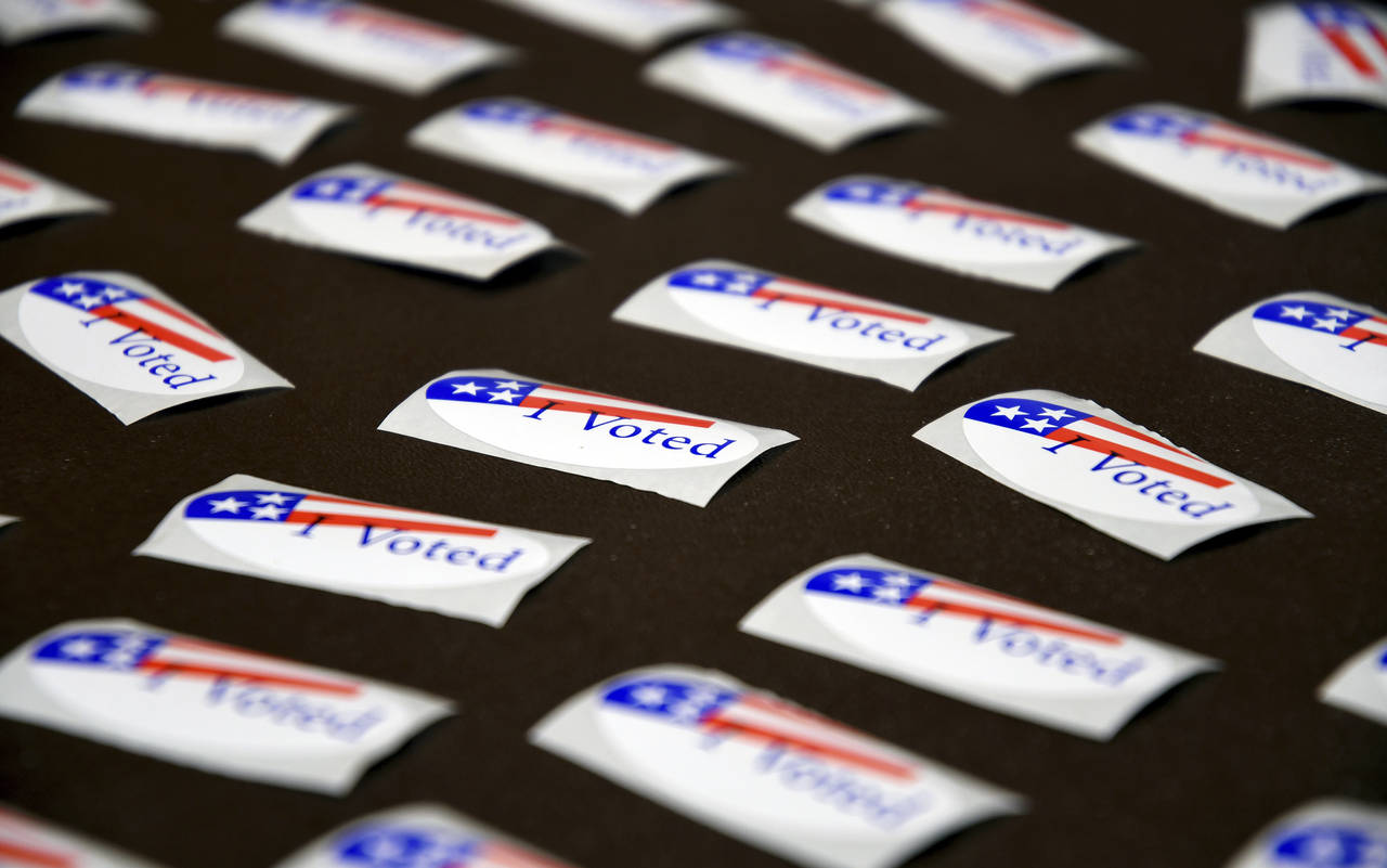 FILE - "I Voted" stickers are displayed at a polling place in Cheyenne, Wyo. on Aug. 16, 2022. The ...