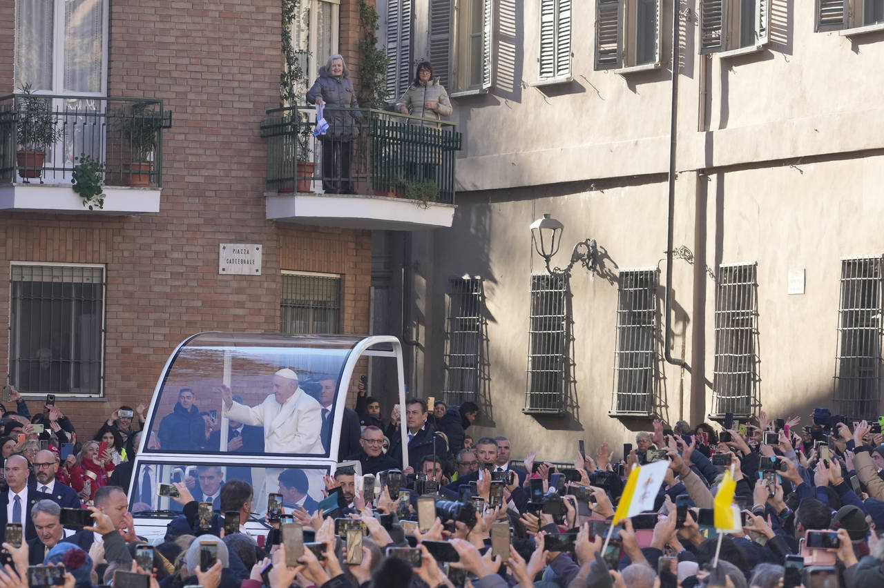 Pope Francis arrives to preside over the holy mass in the Cathedral of Asti, northern Italy, Sunday...