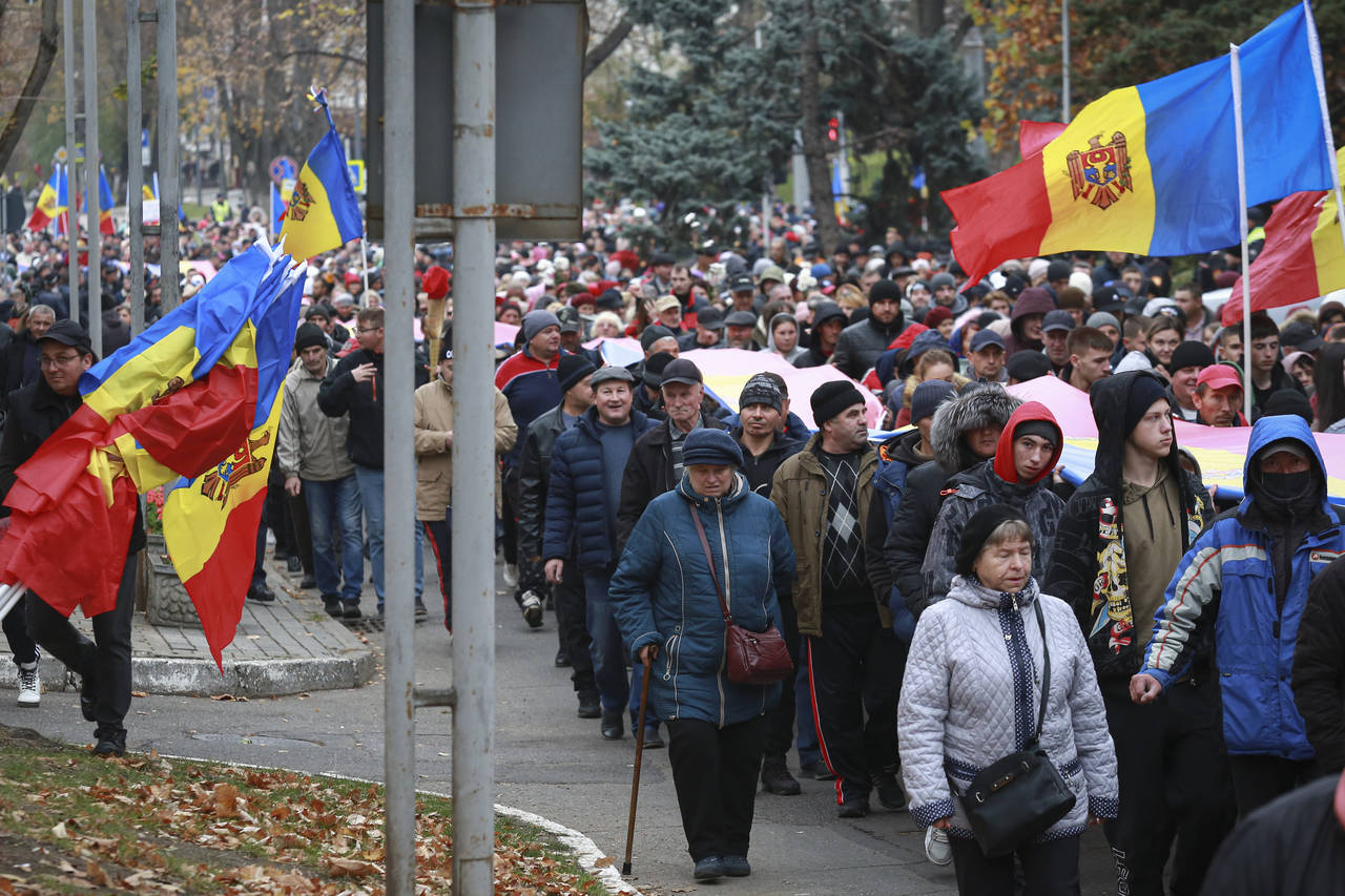 People march during a protest initiated by the populist Shor Party, calling for early elections and...