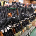 
              FILE - Semi-automatic rifles are displayed at Coastal Trading and Pawn, Monday, July 18, 2022, in Auburn, Maine. President Joe Biden and the Democrats have become increasingly emboldened in pushing for stronger gun control. The Democratic-led House passed legislation in July to revive a 1990s-era ban on certain semi-automatic guns, with Biden’s vocal support. And the president pushed the weapons ban nearly everywhere that he campaigned this year. (AP Photo/Robert F. Bukaty, File)
            