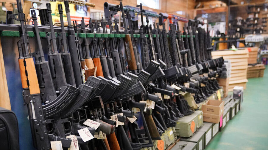 FILE - Semi-automatic rifles are displayed at Coastal Trading and Pawn, Monday, July 18, 2022, in A...