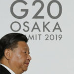 
              FILE - Chinese President Xi Jinping arrives for the welcome and family photo session at G-20 leaders summit in Osaka, Japan, on June 28, 2019. After a lengthy absence from major international gatherings, Chinese leader Xi Jinping is leaving his country's COVID bubble and venturing abroad next week into a dramatically changed world marked by rising confrontation. Xi will attend the G-20 meeting of industrial and emerging market nations in Indonesia followed by the Asia-Pacific Economic Cooperation summit in Thailand. (Kim Kyung-Hoon/Pool Photo via AP, File)
            