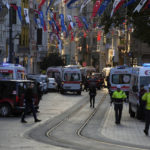 
              Police vehicles and ambulances are parked at the site of an explosion on Istanbul's popular pedestrian Istiklal Avenue in Istanbul, Turkey, Sunday, Nov. 13, 2022. Istanbul Gov. Ali Yerlikaya tweeted that the explosion occurred at about 4:20 p.m. (1320 GMT) and that there were deaths and injuries, but he did not say how many. The cause of the explosion was not clear. (AP Photo/Francisco Seco)
            