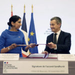 
              British Home Secretary Suella Braverman signs an agreement with French Interior Minister Gerald Darmanin, at the Interior Ministry in Paris, France, Monday Nov. 14, 2022, to try to curb migration across the English Channel - a regular source of friction between the two countries. (Stefan Rousseau/Pool via AP)
            