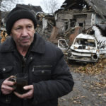 
              Ivan Kulta, 68, drinks tea next to his destroyed apartment building after Russian shelling in Pokrovsk, Donetsk region, Ukraine, Friday, Nov. 4, 2022. (AP Photo/Andriy Andriyenko)
            
