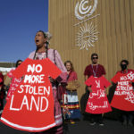 
              Demonstrators hold signs as part of a protest demanding no more stolen relatives and stolen land with the group Indigenous Women Action at the COP27 U.N. Climate Summit, Tuesday, Nov. 15, 2022, in Sharm el-Sheikh, Egypt. (AP Photo/Peter Dejong)
            