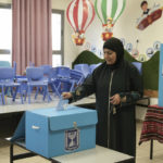 
              A Palestinian citizen of Israel votes for Israel's parliamentary election at a polling station in the town of Taibeh, Israel, Tuesday, Nov. 1, 2022. Israel is holding its fifth election in less than four years. (AP Photo/Mahmoud Illean)
            