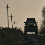 
              Ukrainian military's Grad multiple rocket launcher drives on the road in the frontline near Bakhmut, Donetsk region, Ukraine, Thursday, Nov. 24, 2022. (AP Photo/LIBKOS)
            