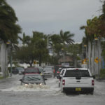 
              Drivers navigate a flooded street following the passage of Hurricane Nicole, Thursday, Nov. 10, 2022, in Fort Pierce, Fla. (AP Photo/Rebecca Blackwell)
            