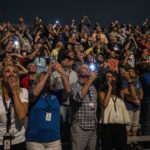 
              In this photo provided by NASA, guests at the Banana Creek watch the launch of NASA's Space Launch System rocket carrying the Orion spacecraft on the Artemis I flight test, early Wednesday, Nov. 16, 2022, at NASA's Kennedy Space Center in Fla. (Keegan Barber/NASA via AP)
            