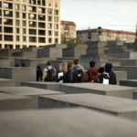 
              Students visit the Holocaust Memorial in Berlin, Germany, Tuesday, Nov. 8, 2022. Holocaust survivors from around the world are warning about the reemergence of antisemitism as they commemorated Wednesday, Nov. 9, 2022, the 84th anniversary of the Kristallnacht or the "Night of Broken Glass", when Nazis terrorized Jews throughout Germany and Austria. (AP Photo/Markus Schreiber)
            