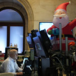 
              Christmas decorations are displayed as traders work on the floor at the New York Stock Exchange in New York, Monday, Nov. 28, 2022. (AP Photo/Seth Wenig)
            
