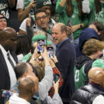 
              Britain's Prince William walks during halftime of an NBA basketball game between the Boston Celtics and the Miami Heat in downtown Boston, Wednesday, Nov. 30, 2022. (Brian Snyder/Pool Photo via AP)
            