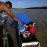 
              Gallons of water for human consumption are transported on passenger boats to serve communities located on the islands of the Bailique Archipelago in the district of Macapa, state of Amapa, northern Brazil, Saturday, Sept. 10, 2022. The Amazon River discharges one-fifth of all the world’s freshwater that runs off land surface. Despite that force, the seawater pushed back the river that bathes the archipelago for most of the second half of 2021, leaving thousands scrambling for drinking water. (AP Photo/Eraldo Peres)
            