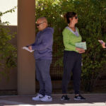 
              Voters wait in line outside a polling station, Tuesday, Nov. 8, 2022, in Tempe, Ariz. (AP Photo/Matt York)
            