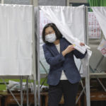 
              Taiwan President Tsai Ing-wen casts her ballots at a polling station in New Taipei City, Taiwan, Saturday, Nov. 26, 2022. Voters headed to the polls across Taiwan in a closely watched local election Saturday that will determine the strength of the island's major political parties ahead of the 2024 presidential election. (Chang Hao-an/Pool Photo via AP)
            