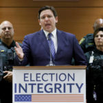 
              FILE - Florida Gov. Ron DeSantis speaks during a news conference at the Broward County Courthouse in Fort Lauderdale, Fla., Aug. 18, 2022. Florida, Georgia, Texas and Virginia all started new law enforcement units to investigate voter fraud in this year’s elections based on former President Donald Trump’s lies about the 2020 presidential contest. So far, those units seem to have produced more headlines than actual cases.  (Amy Beth Bennett/South Florida Sun-Sentinel via AP, File)
            