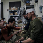 
              Ukrainian soldiers receive first aid in a hospital in Bakhmut, Donetsk region, Ukraine, Wednesday, Nov. 9, 2022. (AP Photo/LIBKOS)
            