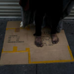 
              A mentally ill homeless man stands on a piece of cardboard on a sidewalk in Los Angeles, Friday, April 15, 2022. A controversial bill signed by Gov. Gavin Newsom could improve that by forcing people suffering from severe mental illness into treatment. But they need to be diagnosed with a certain disorder such as schizophrenia and addiction alone doesn't qualify. (AP Photo/Jae C. Hong)
            