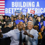 
              President Joe Biden poses for photos with Maryland Democratic gubernatorial candidate Wes Moore during a campaign rally at Bowie State University in Bowie, Md., Monday, Nov. 7, 2022. (AP Photo/Susan Walsh)
            