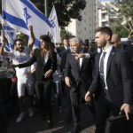 
              Israeli Prime Minster Yair Lapid arrives to vote during Israeli elections in Tel Aviv, Tuesday, Nov. 1, 2022. (AP Photo/Ariel Schalit)
            