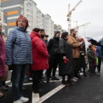 
              Local residents stand waiting to get keys to new apartments in a new apartment building in Cheryomushki district, in Mariupol, Donetsk People's Republic, Ukraine, Friday, Nov. 4, 2022. (AP Photo/Alexei Alexandrov)
            